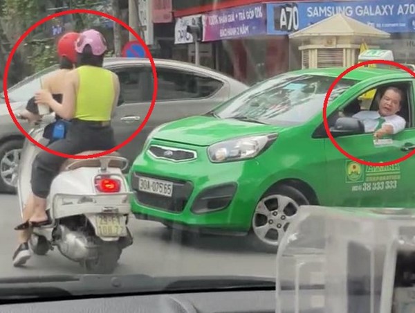Clip: Hai cô gái dừng đèn đỏ giữa đường đôi co với tài xế taxi