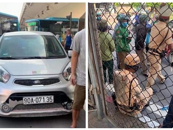 Ô tô kéo lê cảnh sát giao thông hàng chục mét ở ngã tư Vọng