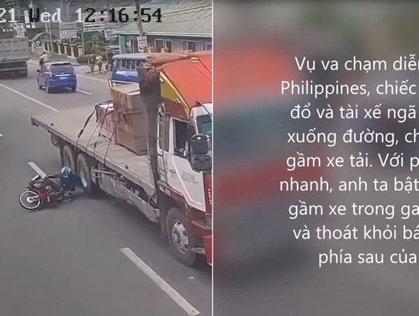 [Clip] Thót tim trước cảnh tài xế xe máy lách khỏi gầm xe tải