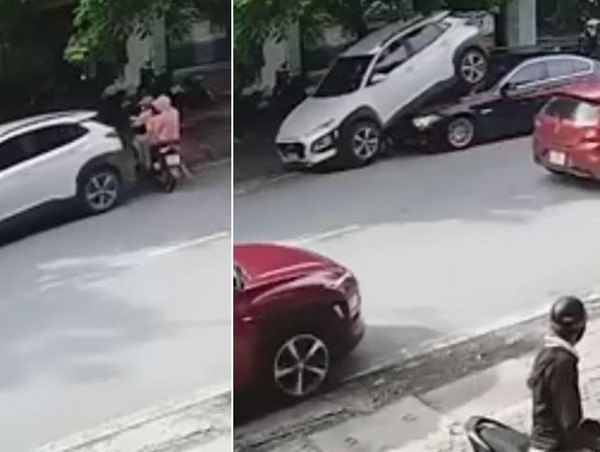 [Clip]: Tài xế lùi ô tô trúng xe máy chở 3 và leo lên đầu xe BMW