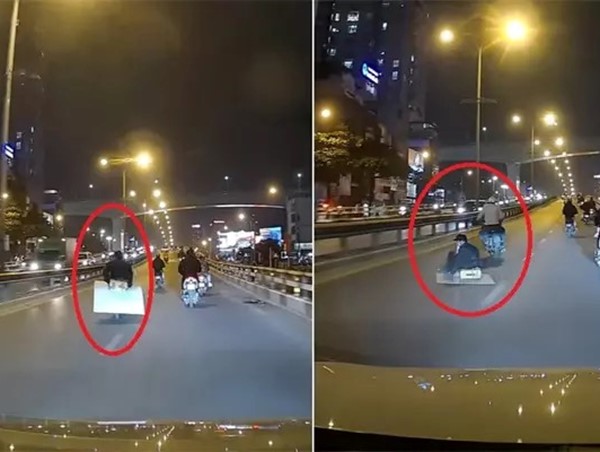 CLIP: Người đi xe máy “trượt ván” trên cầu vượt tại Ngã tư Vọng