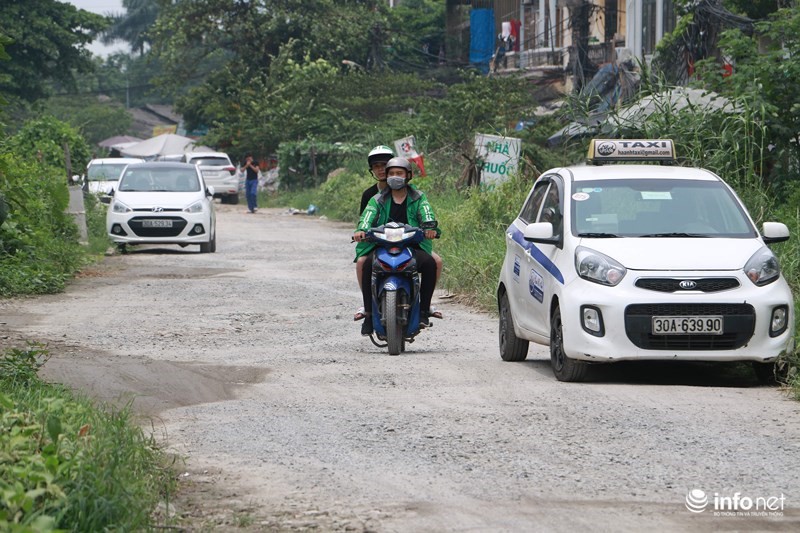 Ha Noi: Co 1km duong lam hon chuc nam chua xong - Hinh anh 1